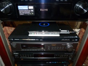 The ZBOX sitting on the entertainment center