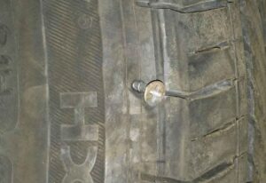 Screw in tire sidewall